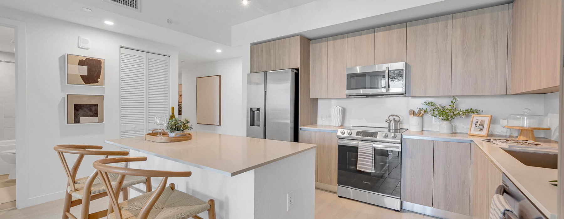 a kitchen with wooden cabinets and stainless steel appliances