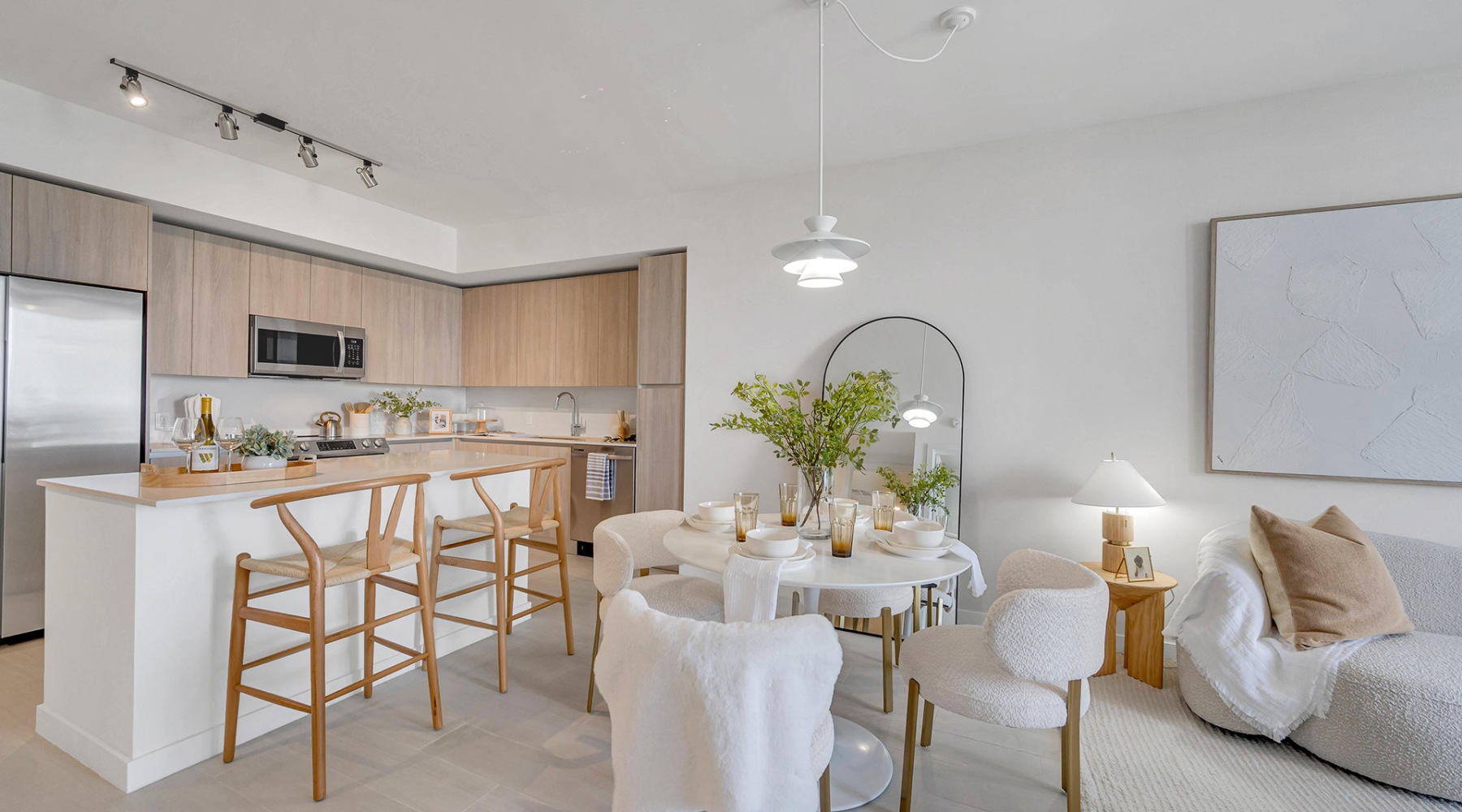 a kitchen with an island and chairs