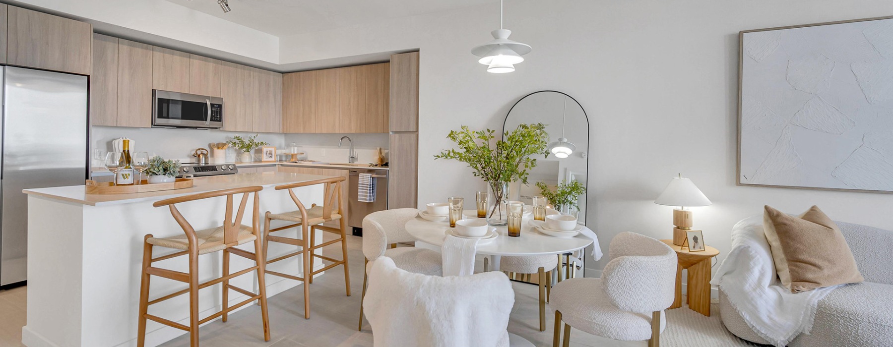 a kitchen with an island and chairs