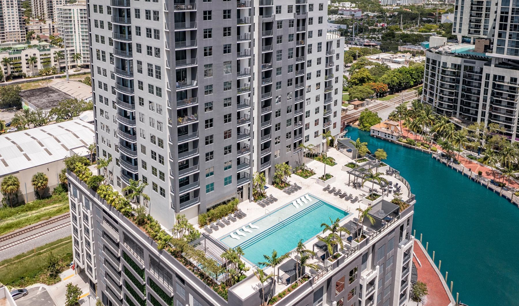 a high angle view of a building with a pool