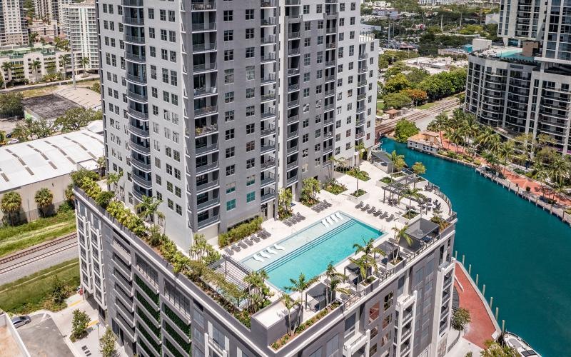 a high angle view of a building with a pool