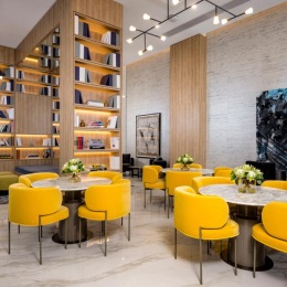 a room with a library tables and chairs