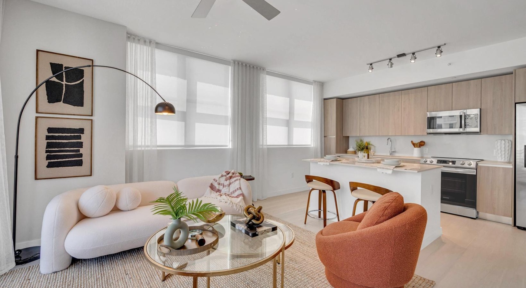living room with couch and  a connected kitchen